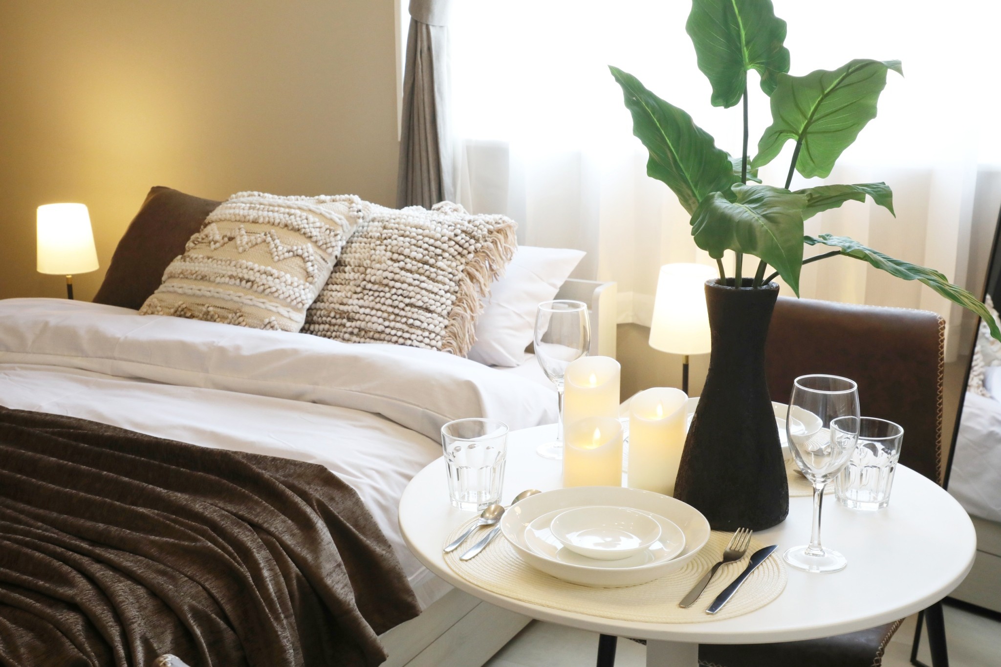 Room 103 dining table set with wine glasses and candles